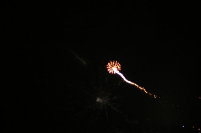 a single firework shooting into the sky