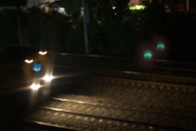 blurred lights of a passing train engine