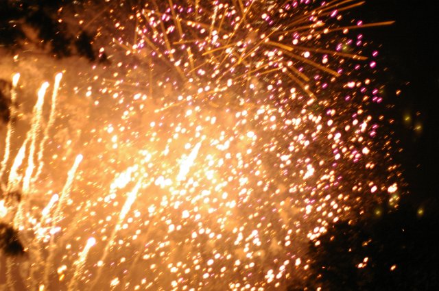 a firework display of yellow glowing sparks