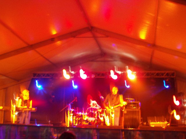 red lights and blurred band on stage