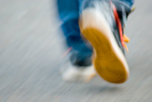 blurred motion image of walking feet