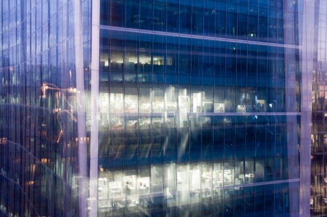 modern office building with abstract multiple exposure and glowing light effect