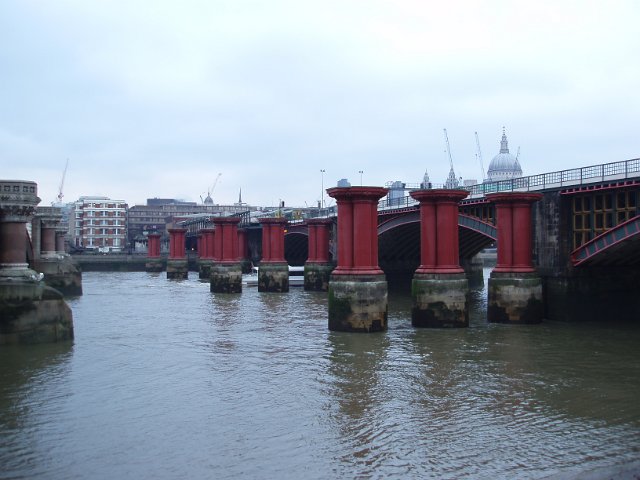 old bridge piers on the river thames, london