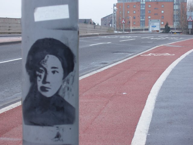 lamp post spraypaint and a cycle track