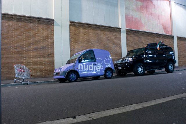 urban transport, shopping trolly, van and a hummer