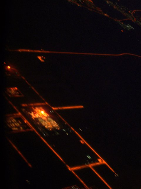 blurred aerial view for a sodium lit road grid