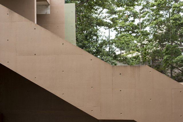 A side on, profile shot of an outdoor concrete stairwell.