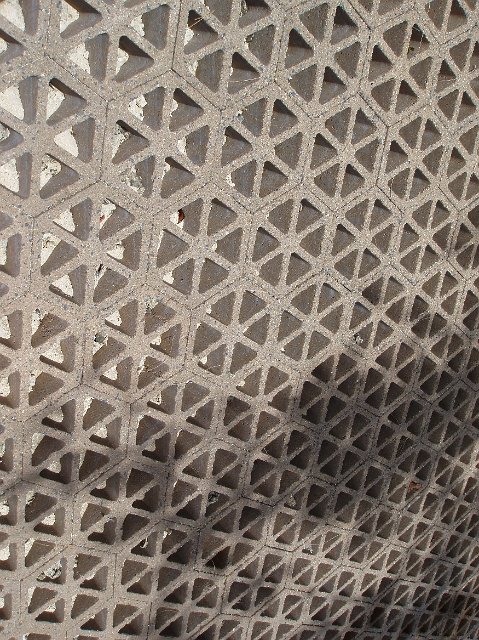 Architectural detail of decorative hexagonal concrete blocks viewed at an oblique high angle