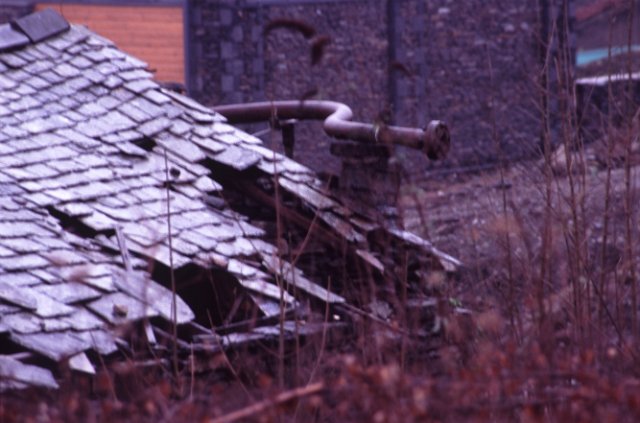 slates on the roof of a derelict building - blurred