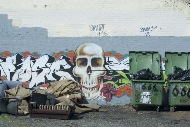 a wall covered in graffiti skull