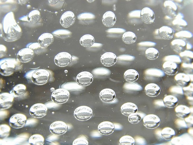 bubbles of air in a decorative glass paperweight
