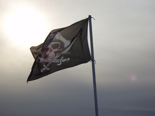skull and crossed bones on a black flag