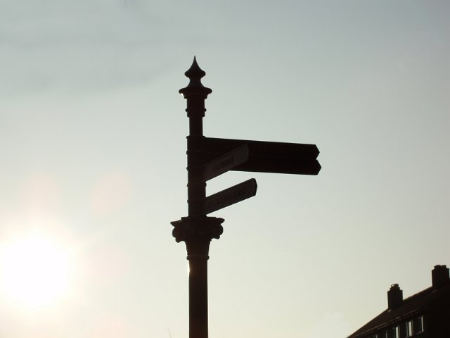 silhouette of an old fashioned signpost