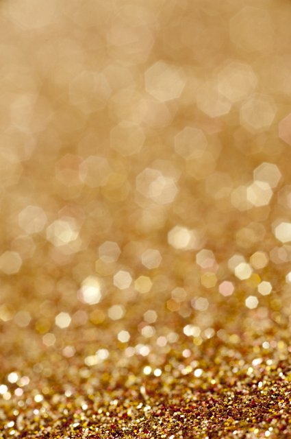 Sparkling copper glitter background texture with shallow dof and blurred copy-space for your seasonal Christmas greeting