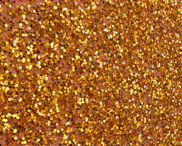 Luxurious and Festive Background Image of Golden Glitter Scattered Full Frame