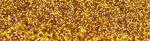 Panoramic Close Up of Golden Glitter, Full Frame Background or Border of Shiny Metallic Glitter