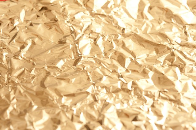 Full Frame Background Image of Luxurious and Festive Shining Golden Crinkled Foil