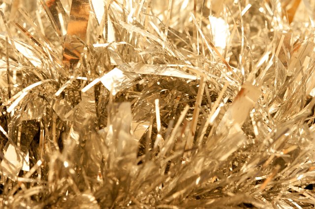 Extreme Close Up of Decorative Gold Tinsel Christmas Garland, Detail of Strands of Gold Foil