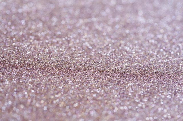 angled background of purple glitter with bokeh effect in the background