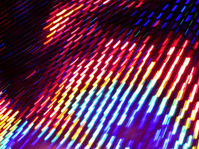 glowing strikes of light formed into a matrix array of colours