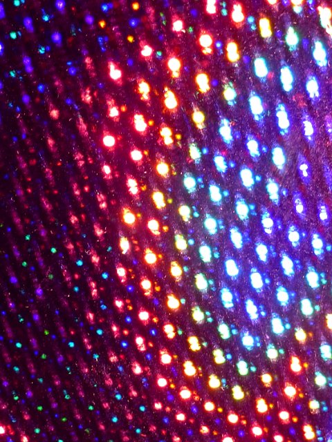 background image of an aray of bright coloured dots of light