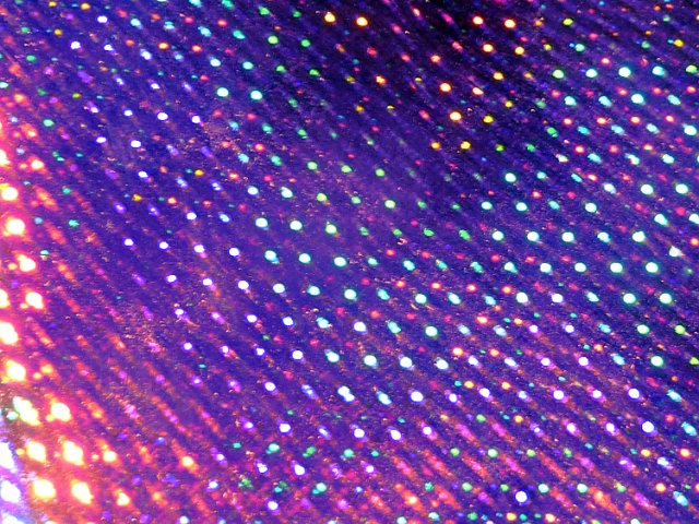 colorful iridescent holographic background with a purple tone