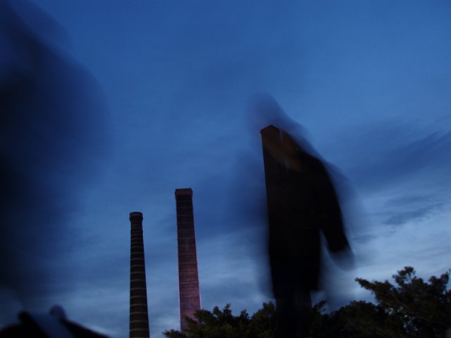 three chimneys, soft ehtereal focus with blurred figures