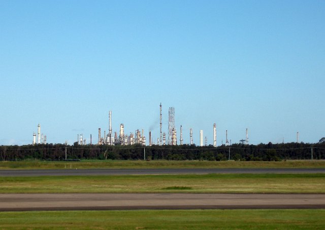 complex array of tanks and chimnies at a chemical plant