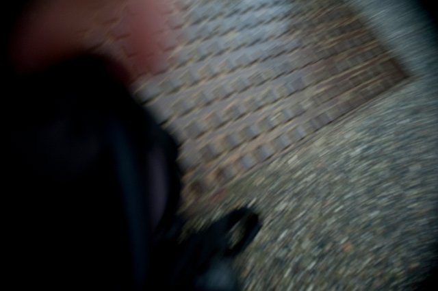 rotational blur image of a floor and legs
