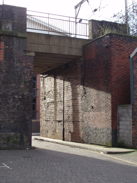 brick railway bridge and stone cobbled roadway