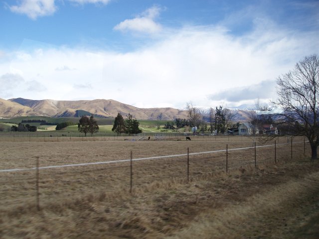 view of arable land and distant mountains