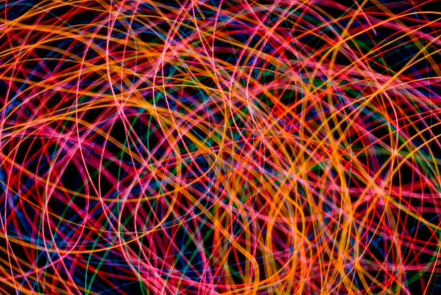abstract background composed on intertwined lines of light