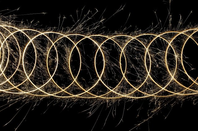 a bright pattern of sparks tracing a looping formation