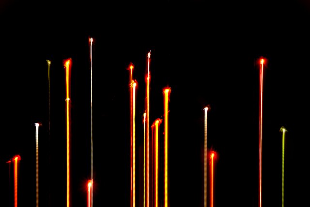 colourful background of glowing christmas fairy light and motion light trails