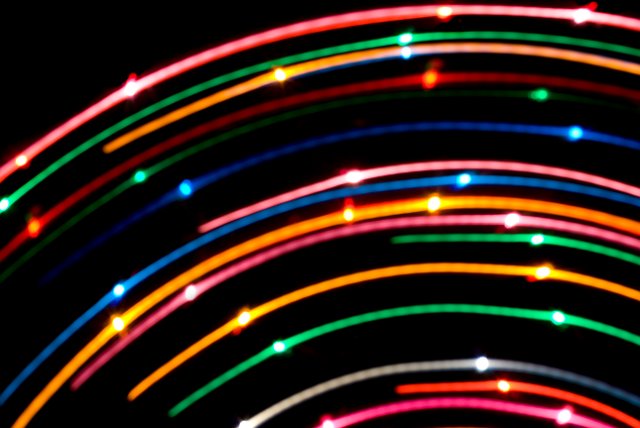 colourful arcs of light and highlights used to produce an eye catching background on black