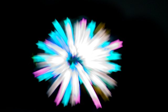 star shaped burst of light, bokeh shapes created from a firework display