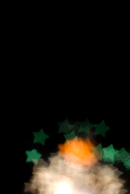 An unusual background of star shaped bokeh shapes