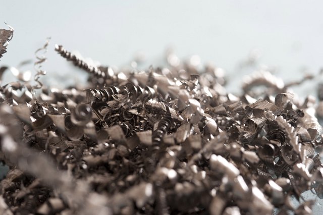 Heap of industrial metal shavings or swarf produced as a waste product during machining