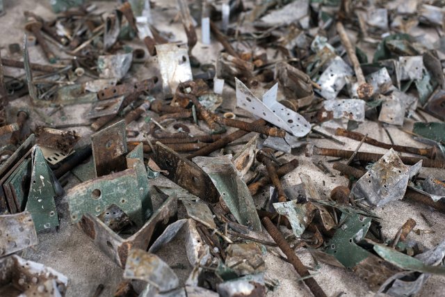 Jumbled background texture of old rusty scrap metal parts conceptual of industrial waste