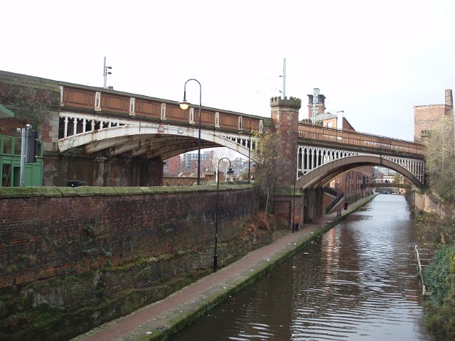 historic mancunian industrial railway viaducts crossing canals
