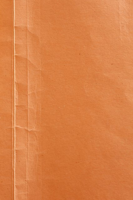 orange think paper background with creases and crinkles