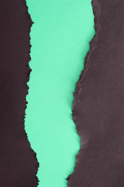 torn paper background with green and black papers