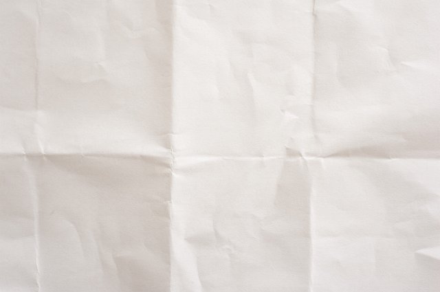 a white paper sheet with straight folded crease marks