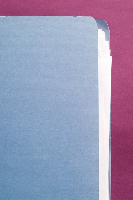 blue document folder background, space for text with a burgundy border and documents peeking out
