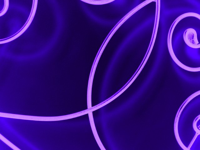 glowing scrollwork metal shapes