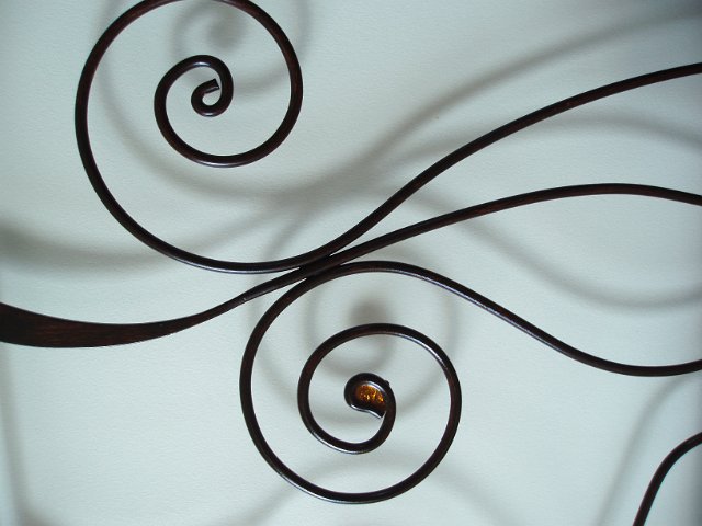 curving metal shapes with background shadow