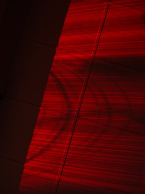 abstract patterns on the ceiling made by a red light