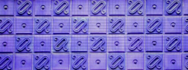 pixelated decorative tiles on an old building wall in blue