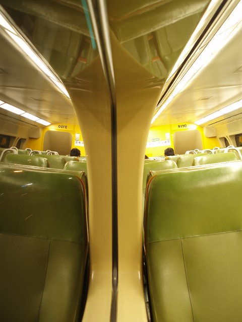 window summetry reflection on a passenger train at night