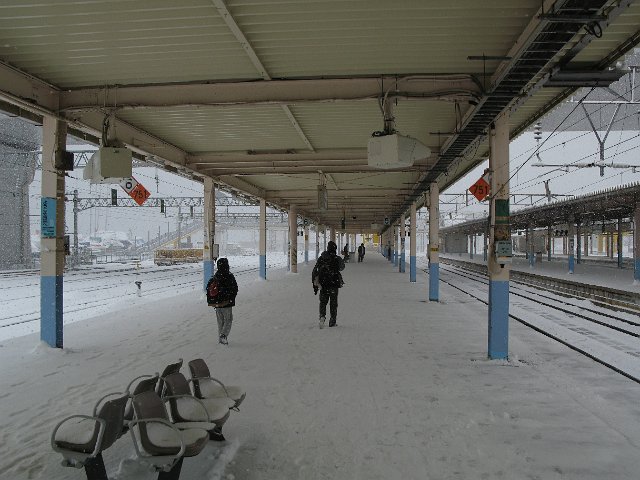 snow on a railway platform in the middle of winter